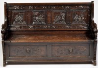 Lot 1224 - A Victorian carved oak settle, the back...