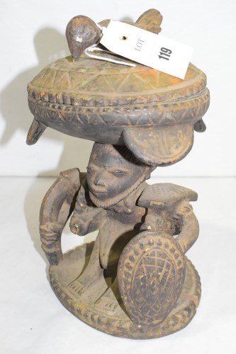 Lot 119 - A Yoruba carved wooden divination bowl, on a...