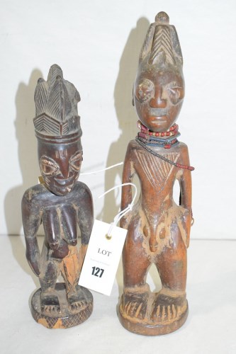 Lot 127 - Yoruba carved wooden Ibeji figures, one female;...