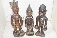 Lot 129 - Yoruba Ibeji carved wooden figures. (3)