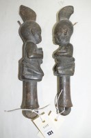Lot 131 - Yoruba Eshu dance wands depicting kneeling...