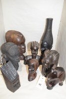 Lot 142 - West African carved wooden busts depicting...