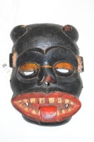 Lot 152 - An African tribal carved wooden mask.