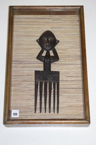 Lot 155 - A large African tribal comb depicting a female...