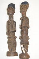 Lot 156 - West African tribal carved wooden male and...
