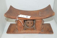 Lot 161 - A South African carved wooden head rest.