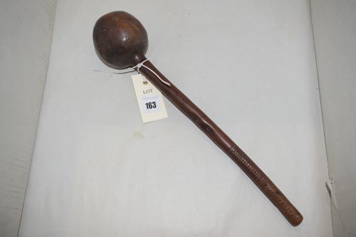 Lot 163 - A South African kuckberrie, carved wooden...