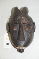 Lot 166 - A West African baule 'Kpan Pre' mask, 21cms.