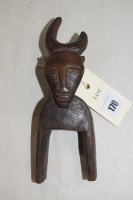 Lot 170 - A West African guro heddle pulley, with bovine...