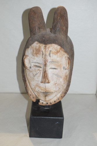 Lot 183 - A West African fang mask, Gabon, white painted...