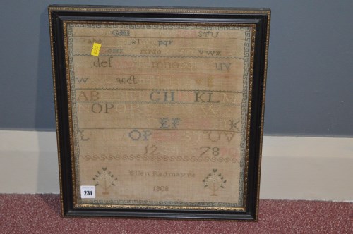 Lot 231 - An early 19th Century woolwork sampler...