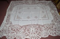 Lot 245 - An early 20th Century tape-lace bed spread...