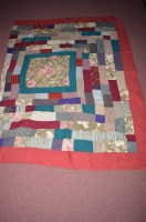 Lot 251 - A late 19th/early 20th Century patchwork quilt...