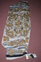 Lot 256 - A Gucci seashell pattern silk scarf/shawl on...