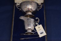Lot 502 - A George V silver cream jug and sugar bowl, by...