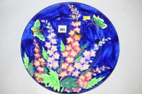 Lot 841 - A Maling 'Hollyhock' plate, on cobalt blue...