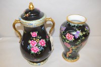 Lot 856 - Maling: a lidded two-handled vase, with peony...
