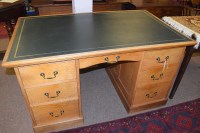 Lot 1151 - A 20th Century stripped oak knee hole desk...
