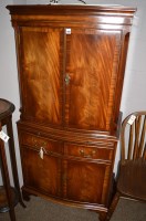 Lot 1262 - A reproduction mahogany drinks cabinet, by...