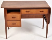 Lot 900 - A 1960's teak desk, probably Danish c.1970,...