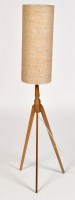 Lot 914 - A rocket style floor lamp with woven shade,...
