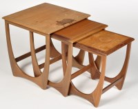 Lot 979 - G-Plan: a nest of three teak occasional tables...