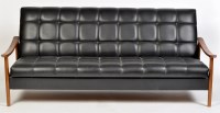 Lot 992 - A 1960's black faux leather day bed, with...