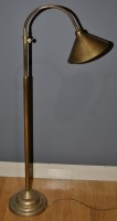 Lot 1004 - A brass floor lamp, with weighted base and...
