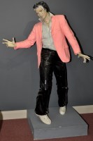 Lot 1014 - A cast plaster model of Elvis Presley, red...
