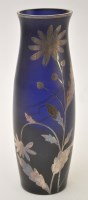 Lot 1042 - A blue glass vase, with white metal flower...