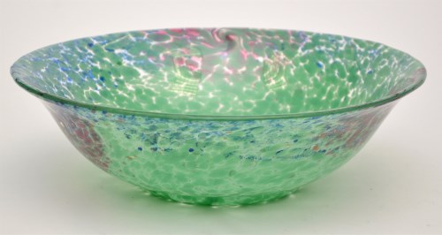 Lot 1099 - A glass bowl, with flared rim, mottled green,...