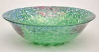 Lot 1099 - A glass bowl, with flared rim, mottled green,...