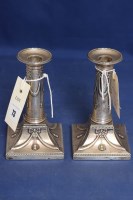 Lot 73 - A pair of Edward VII silver candlesticks, by...