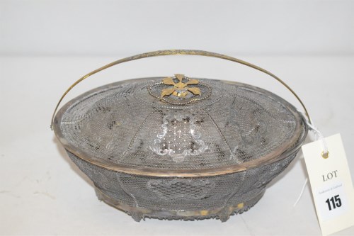 Lot 115 - A gilt white metal filigree basket and cover,...