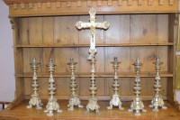 Lot 427 - A set of seven ecclesiastical candlesticks...