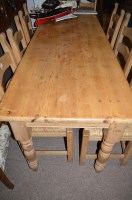 Lot 659 - A stripped pine kitchen table, with draw to...