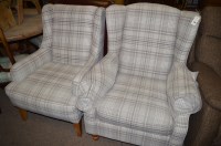 Lot 670 - Two easy armchairs upholstered to match.