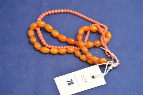 Lot 78 - A coral bead necklace; together with an amber...