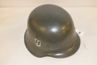Lot 420 - A WWII German SS helmet.