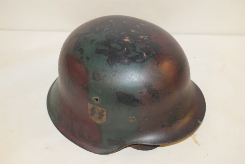 Lot 425 - A WWII German SS helmet.