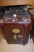 Lot 620 - A red painted metal safe, by W.H. Wakefield &...