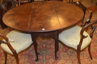Lot 637 - A George III mahogany drop leaf dining table,...