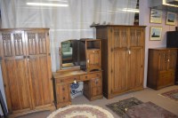 Lot 739 - A mid 20th Century carved oak bedroom suite,...