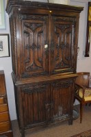 Lot 754 - A heavily carved and stained oak Continental...