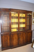 Lot 784 - A Georgian style mahogany breakfront bookcase,...
