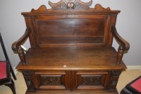 Lot 789 - A Victorian carved and stained oak hall bench...