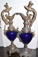 Lot 427 - A pair of baroque style ewers with lion and...