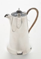 Lot 191 - A George V silver hot water jug, by Walker &...