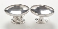 Lot 201 - Two Edwardian silver Arts and Crafts table...