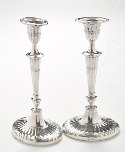 Lot 209 - A pair of Edward VII silver candlesticks, by...